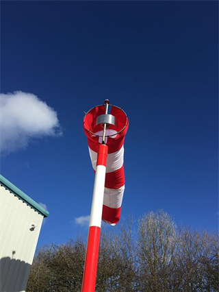 A windsock is used to indicate the wind direction and its intensity to helicopter operator. Every heliport must be provided with at least one windsock and if the Landing area is used also for night operations, the windosck must be lighted.